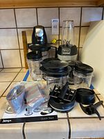 Overall view of blender bases, cups, jars, lids