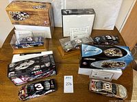All five 1:24 scale cars with boxes, certificates and display cases