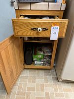 Cabinet showing vacuum sealers and bag boxes