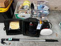 Lot overview with two polishers in cases, pads, cloths, telescopic pole