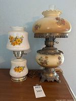 Both lamps side by side on table