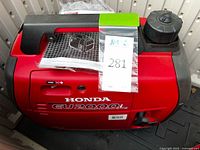 Top and side view of Honda EU2000i generator showing model marking and overall condition
