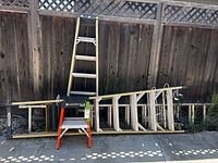 Overall view of three ladders and folding stool