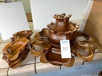 Full set showing rotating base, large dishes, central bowl with lid, stack of small bowls