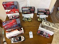 Tabletop view showing all five die-cast cars with boxes