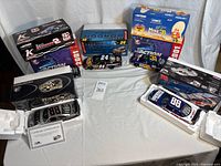 Overview of all boxed and unboxed die-cast cars on table