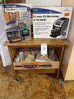 Overall lot showing FS-44P box, Power Wrapper unit, and bin filled with coin wrappers