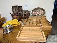 Group shot of bamboo trays, rattan baskets, yellow linens, metal sauce bowl