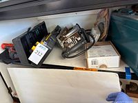 Overall lot showing Skilsaw saw, screwdriver, blades, level, Dremel box and black case