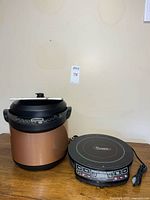 Pressure cooker and induction cooktop full view