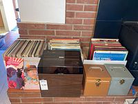 Overall lot showing four boxes of LPs, stack of boxed sets, three record cases