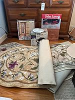 Group shot showing all items: rugs stacked, cedar liner box, sweater organizer package, fountain box