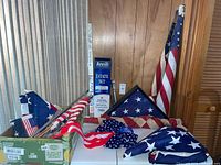 Assorted flags, Annin box, small flags, poles, bow visible