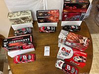 Overview of all five boxed die-cast cars on table