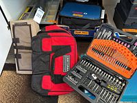 Overview showing Craftsman tool bag, trunk organizers, Bosch case, drill/bit set and mesh panel
