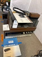 Overall view of turntable stacked atop receiver with manual