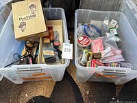 Overview of two totes with welding rods, OptiVISOR box and assorted hardware