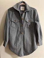 Bluenotes blue-grey women's shacket front view, showing button-up long sleeves and two buttoned chest pockets