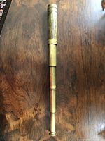 Telescope partially extended showing brass draws