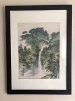 Full view of framed painting with mat and black frame