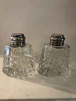 Two trapezoid crystal shakers front view