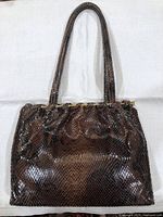 Full front view of handbag showing overall shape, color and double handles