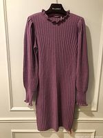 Full front view of ribbed cashmere dress on hanger