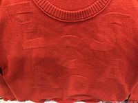 Front view showing tonal ESCADA lettering and color