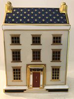 Front view with red door and gold detailing