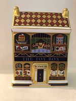 Front view showing THE TOY BOX storefront and toy motifs