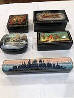 Group shot of all five signed Russian lacquer boxes