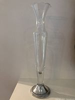 Full view of vase showing glass body and sterling base