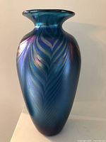 Front view of cobalt blue iridescent pulled feather glass vase