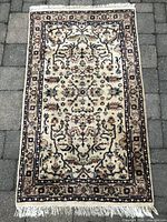 Full view of rug showing overall design and fringe