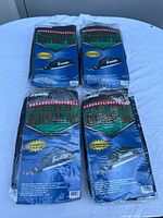 Four Franklin youth league baseball/softball equipment bags in original packaging.