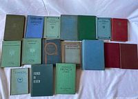 All 17 books arranged in two rows