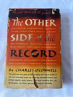 Front dust jacket displaying title and author, visible wear and tear