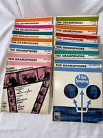 All twelve issues stacked showing front covers and title bands