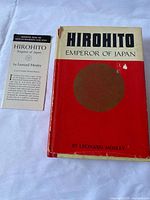 Front view of book with dust jacket and pamphlet