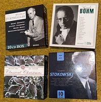 Front view of all four 10-CD box sets