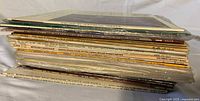 Side view of full stack of LPs showing quantity and spines