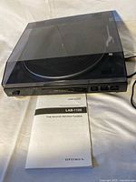 Turntable with closed dust cover and manual