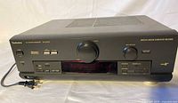 Front view of Technics SA-DX750 receiver showing overall condition and attached power cord