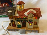 Front view of lighted porcelain train station