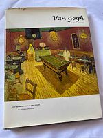 Dust-jacketed front cover showing Van Gogh’s painting The Night Café