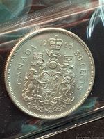 Reverse side showing Canadian coat of arms, date 1965, 'CANADA 50 CENTS'.