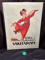 Full view of the Dancing Clotilde Alexandre Sakharoff vintage style poster reproduction on heavyweight matte paper, showing dancers in red flowing dresses.