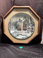 Full view of the framed plate with hexagonal wooden oak frame showing the winter watermill scene.