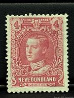 Front of the 1928 Newfoundland 4 cent lilac rose stamp showing Prince of Wales portrait and intricate design.