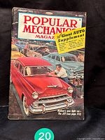 Front cover of the February 1953 Popular Mechanics magazine showing a red Hudson car and announcing a giant auto supplement section.